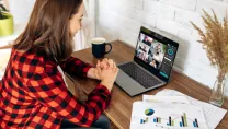 Woman attending an online meeting from home