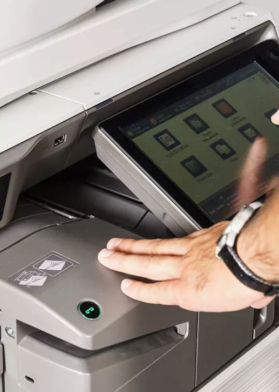 Man using a software on black and white printer